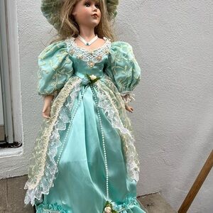 Elegant Mint Green Porcelain Doll with Lace Details